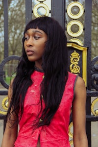 a woman wearing a red dress