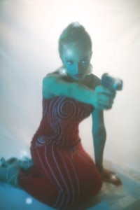 a woman holding a gun