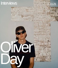 an interview with oliver day in front of a cross