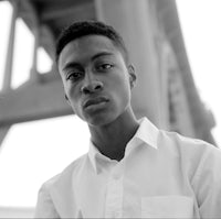 a black and white photo of a young man