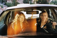 two women sitting in a car