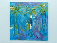 a painting of palm trees on a blue wall